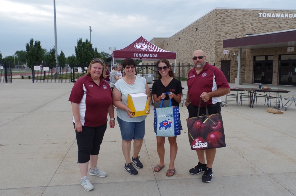 Pictured volunteering at the event, from left: ​Common Council President Jenna Koch​;​ Karen Russell, teaching assistant​; Maureen Zarcone, Tonawanda Education Association president and Tonawanda High School social studies teacher; and​ Tom Newman, councilman​ . (Photos by Larry Austin)